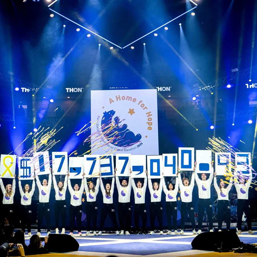 THON students revealing the yearly fundraising total