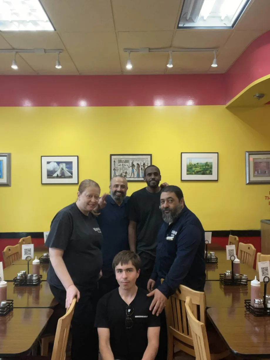 Nicholas Cabel with the Kabab Cafe team inside the restaurant in Wayne, PA